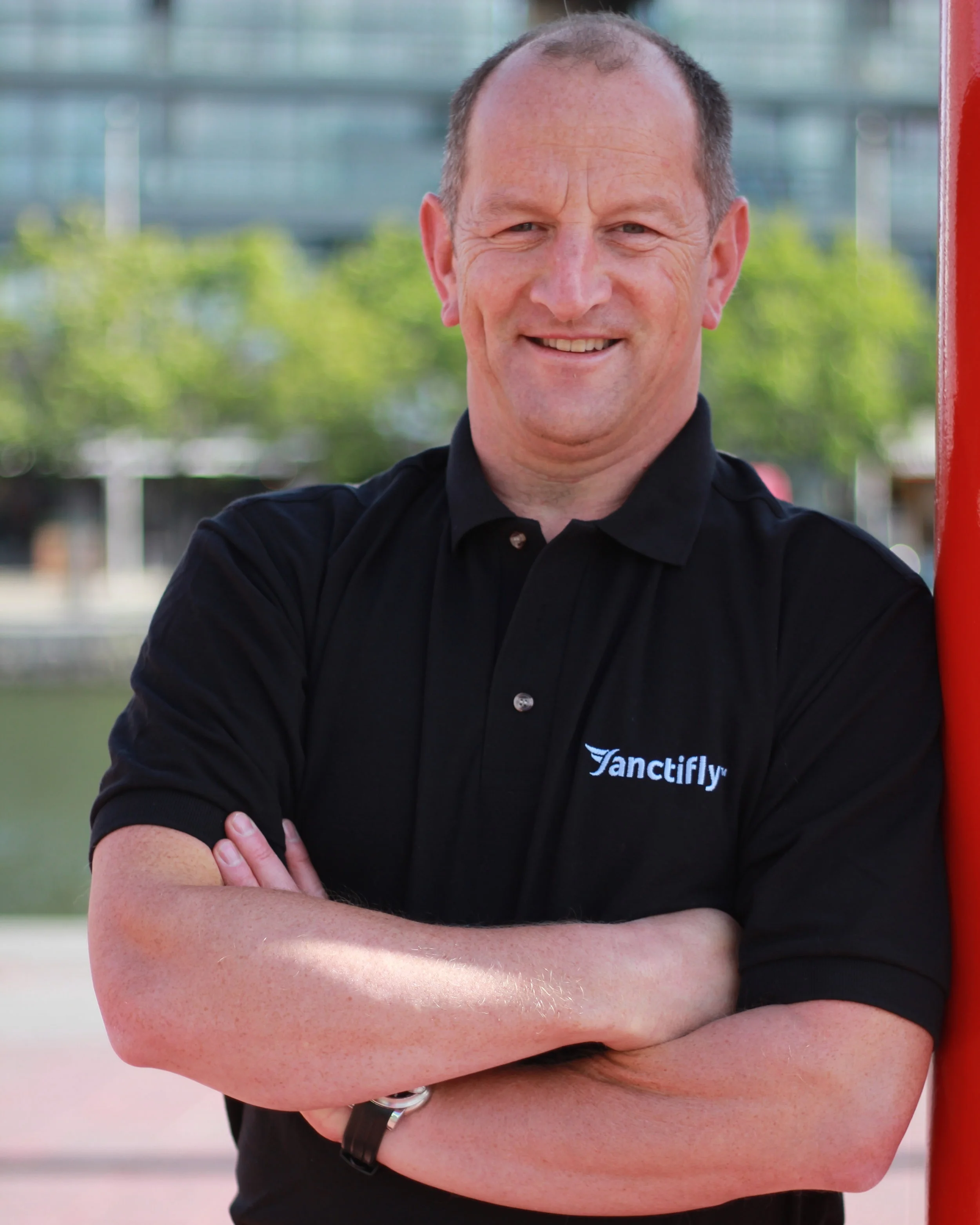 Karl Llewellyn, Founder and CEO of Sanctifly - Business portrait at company office, providing corporate travel wellness solutions since 2016